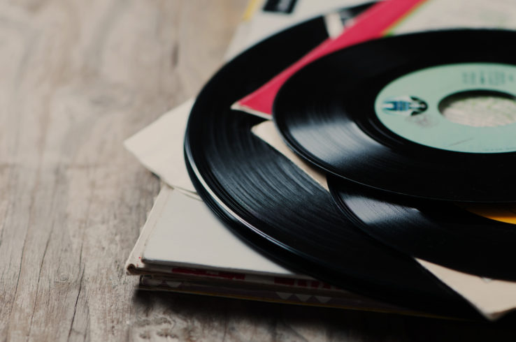 old vinyl record on the wooden table, selective focus